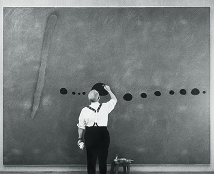 Miro retouching Bleu II, Miró exhibition, Grand Palais, Paris