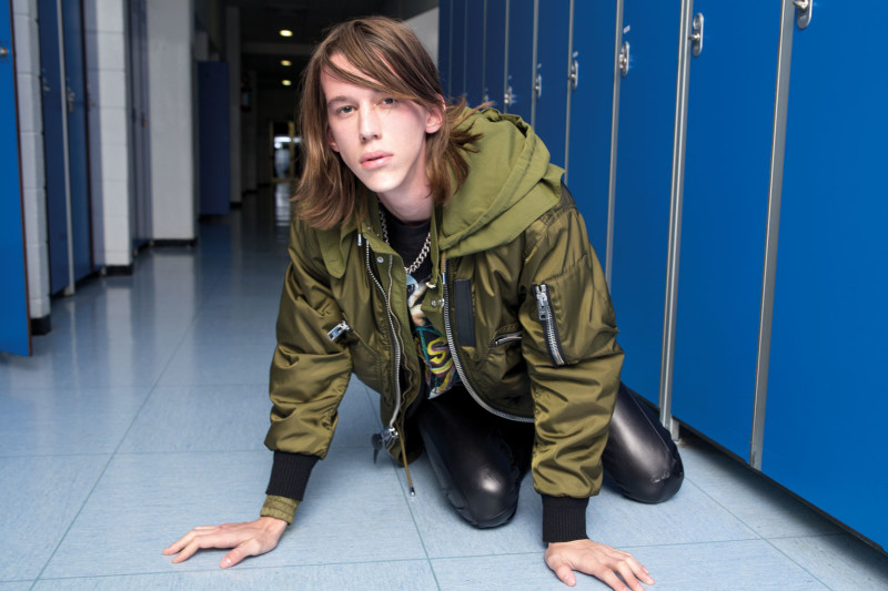 DANCING IN THE EYE OF THE HURRICANE ph. Lorenzo Marcucci for Collectible DRY Armand wears nylon bomber with leather detail, Coach, lightweight hooded parka, Versus, vintage t-shirt, East 17, leather pants, Coach, sandals, MSGM, socks, Vetements, necklace, Vivienne Westwood from stylist's archive.