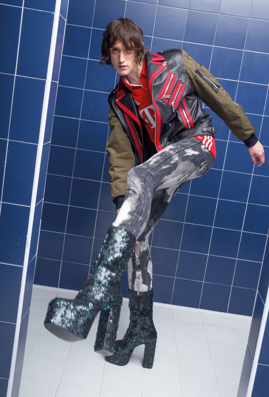 DANCING IN THE EYE OF THE HURRICANE ph. Lorenzo Marcucci for Collectible DRY Edouard wears leather and nylon biker jacket and sequined boots DSquared2, soccer polo shirt Adidas Originals, jeans Wrangler customized by stylist.