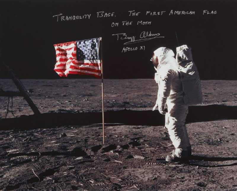 [APOLLO 11]. ALDRIN WITH THE STARS AND STRIPES. COLOR PHOTOGRAPH, SIGNED AND INSCRIBED BY BUZZ ALDRIN, Courtesy of Sotheby's