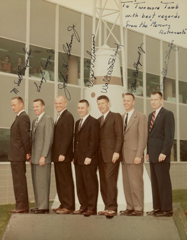 [PROJECT MERCURY]. VINTAGE COLOR PHOTOGRAPH INSCRIBED AND SIGNED BY THE MERCURY SEVEN TO BILL TAUB, Courtesy of Sotheby's