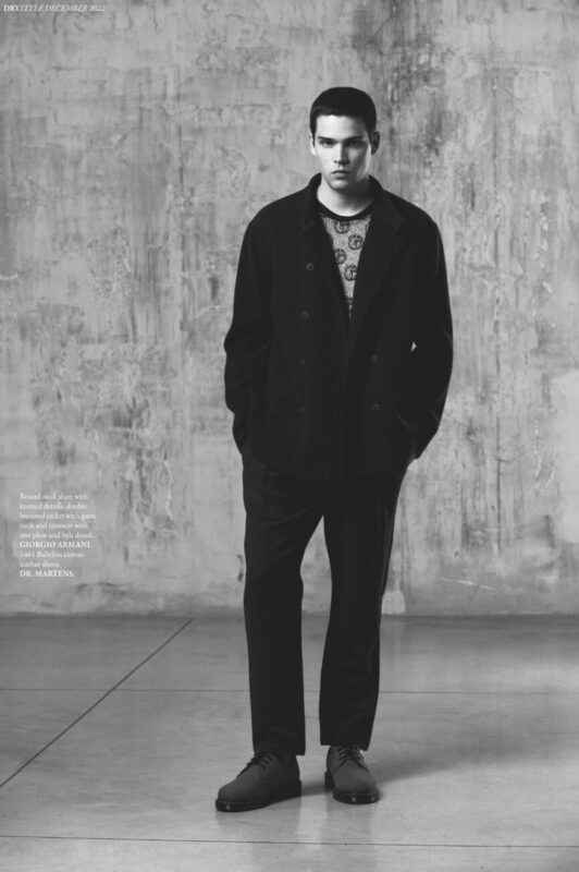 Round neck shirt with knitted details, double breasted jacket with guru neck and trousers with one pleat and belt detail, GIORGIO ARMANI. 1461 Babylon canvas leather shoes, DR. MARTENS.