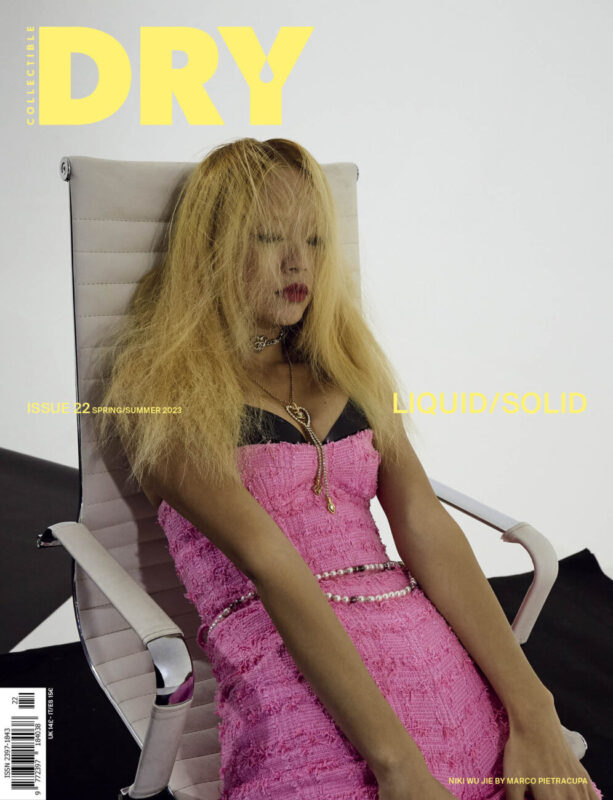 ON COVER NIKI WU JIE is wearing a playsuit in pink cotton tweed, jewel belt, golden necklace CHANEL